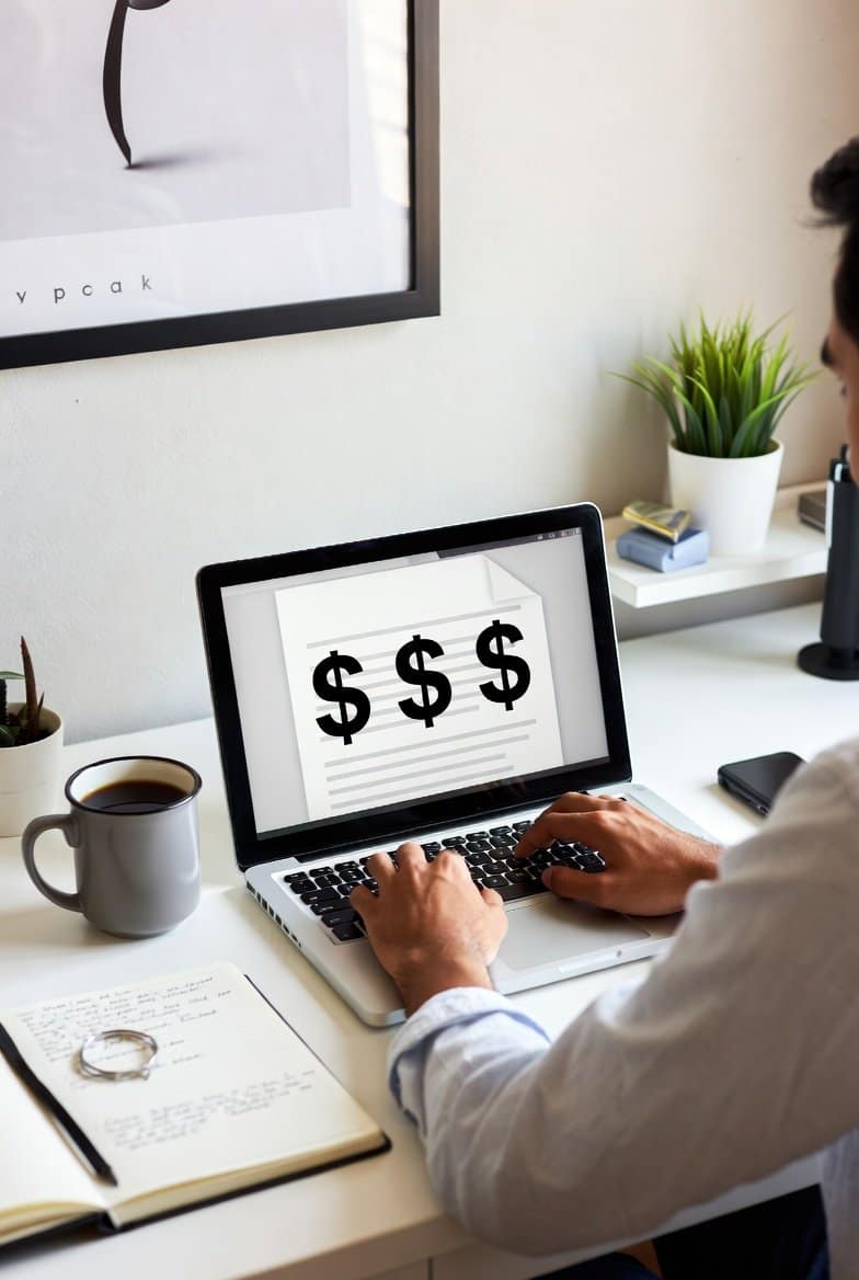 A clean modern image of a writer at a desk with a laptop showing dollar signs coffee mug and open notebook. Bright colors inspiring for beginners | Best Platforms to Earn Money Writing 2025: Real Ways Beginners Made $500+ Monthly | TamzidulHaque.com best platforms to earn money writing 2025